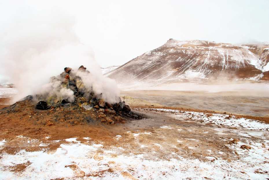 Smoking fumarole and mud geothermal near Hverir, Myvatn Lake area, Iceland.