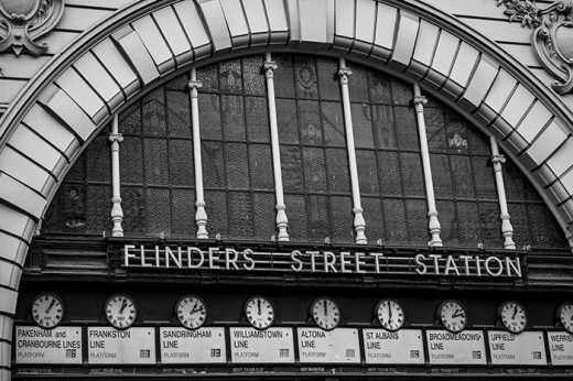 Photograph of the iconic clocks at Flinders Street Train Station entrance.