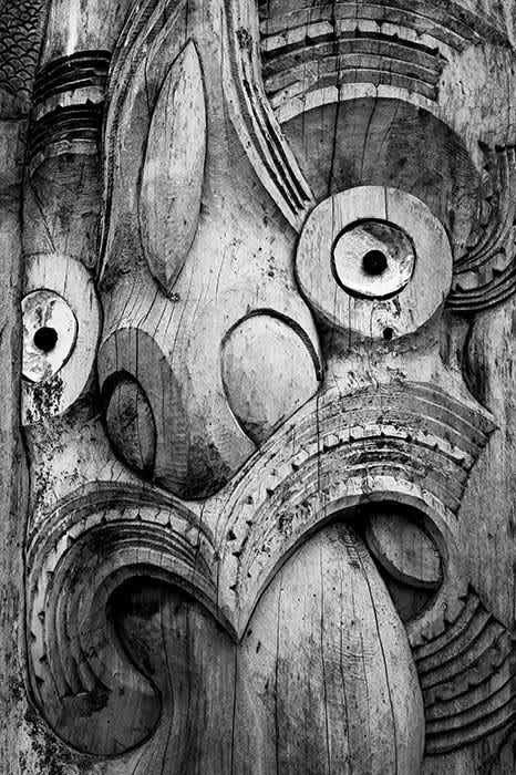 Photograph of weathered Maori wood carving.