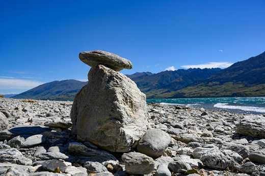 Photograph of rocks stacked on the shore of Lake Wanaka.