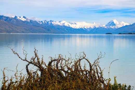 Photograph looking across Lake Pukaki to the mountain ranges in the distance.