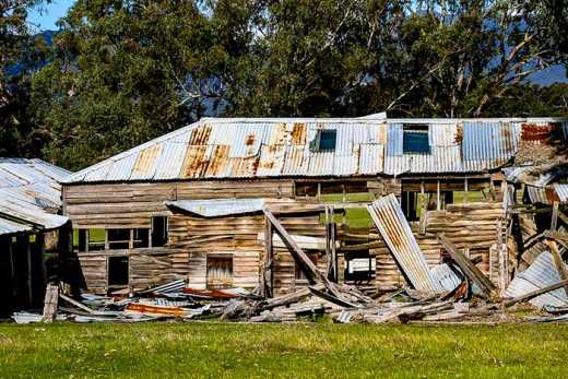 Photograph of farm shed in state of disrepair.