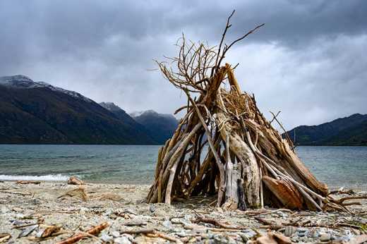 Photograph of teepee constructed from driftwood.
