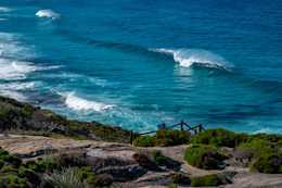 Photograph of beautiful waves breaking off of Cable Beach in the Torndirrup National Park near Albany, Western Australia.