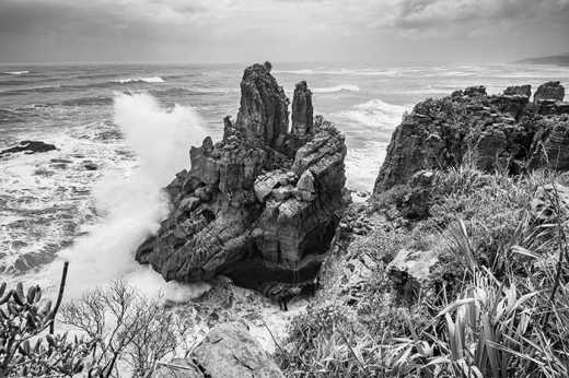 Photograph of waves crashing into rocks at Dolomite Point.