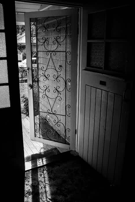 Photograph of old doorway from inside of home.