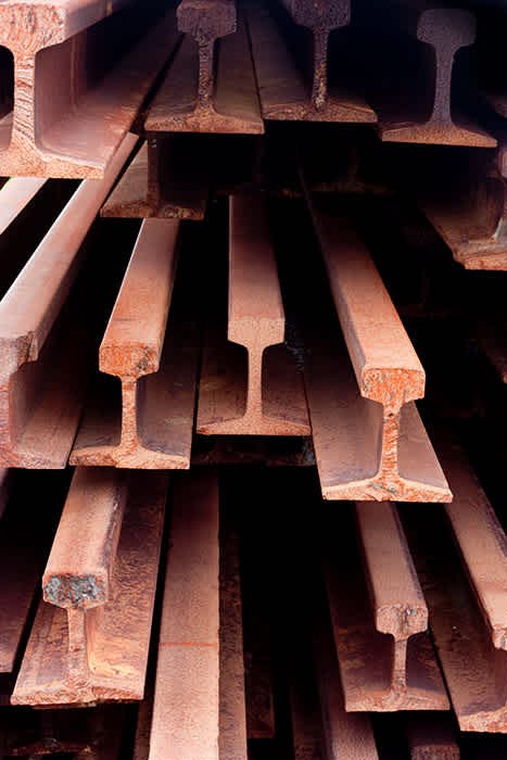 Photograph of stack of old rails.