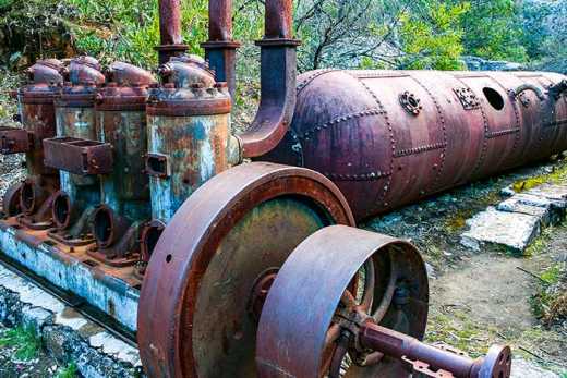 Photograph of the rusting remains of machinery at Heatherlie Quarry.  Sandstone was extracted here and used in the construction of many notable buildings including Parliament House Melbourne.