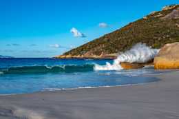 Waves crashing over the distinctive boulders on Little Beach in the Two Peoples Bay Nature Reserve near Albany, Western Australia.