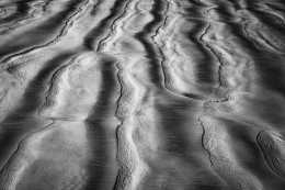 Photograph of the patterns left in the sand at low tide.