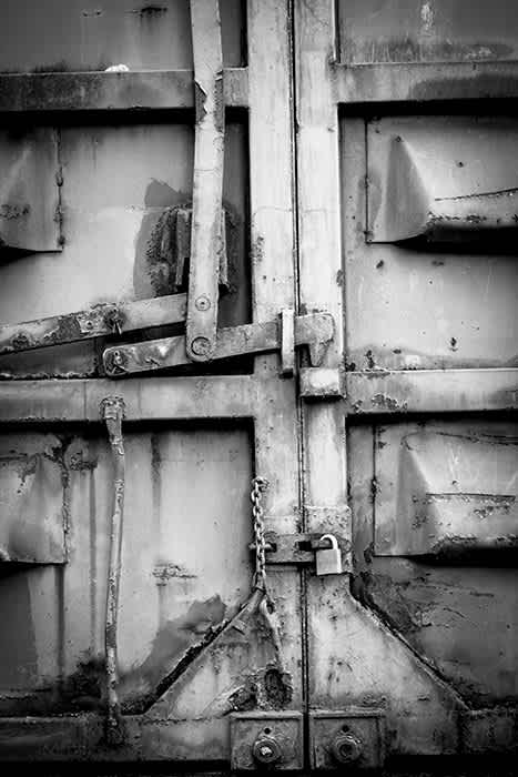 Photograph of old rusting door mechanism.