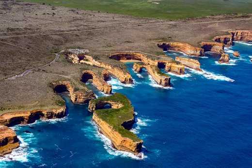 Aerial Photograph of spectacular coastal erosion in the high limestone cliffs that are the dominant feature in Port Campbell NP.