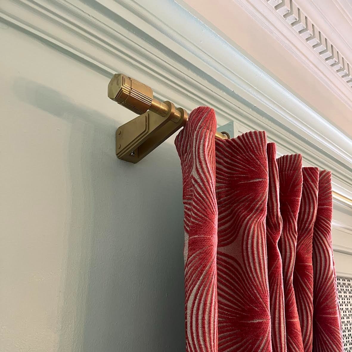 Custom cast brass Art Deco tiered finial. Velvet curtain panel.