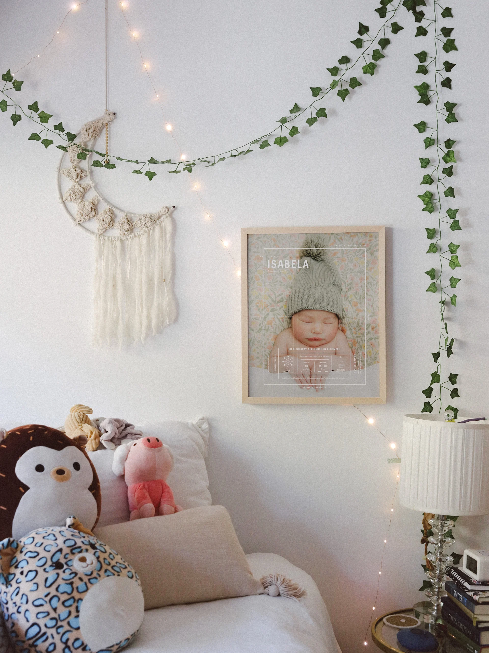 Hands hold a framed Mama print featuring a family photograph.