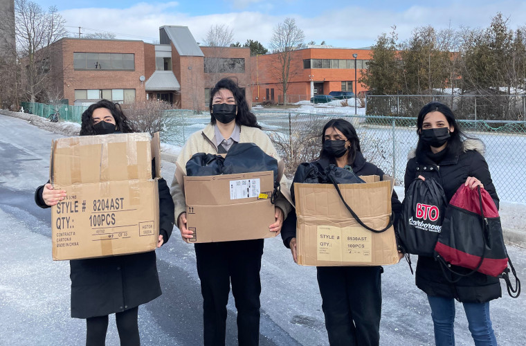 BTO members holding care packages