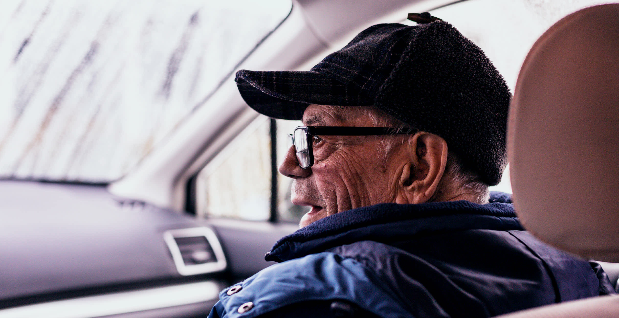elderly man in car
