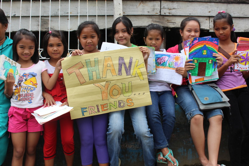 Students in the Philippines with letters written during the Challenge.