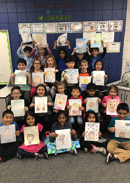 Ms. Musa's 2nd Graders with their finished portraits!