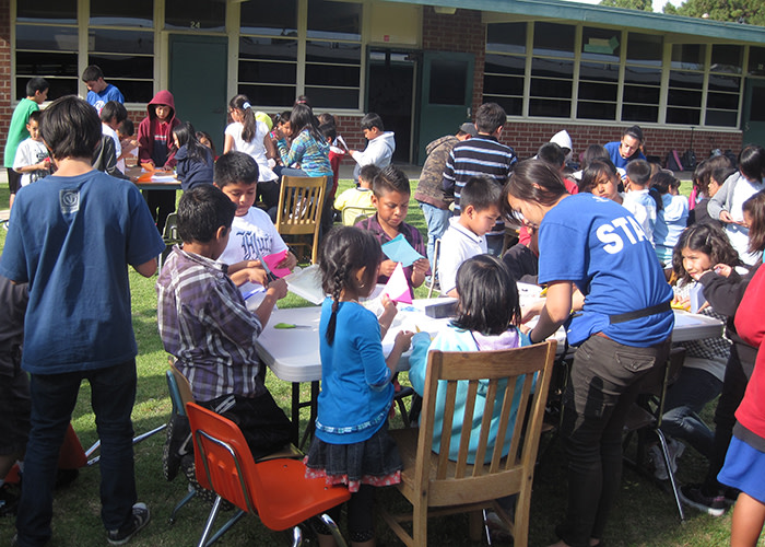 Making paper cranes outdoors with the Garden Grove team!