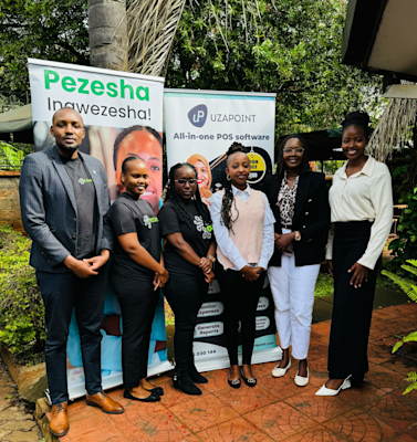 Pezesha and Uzapoint team pose for a photo after the successful ceremony