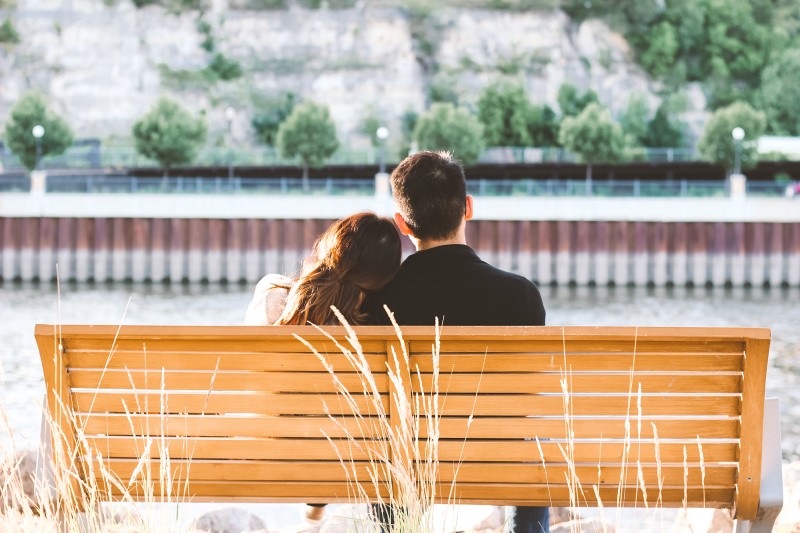 a couple sitting on a bench [Article Image]