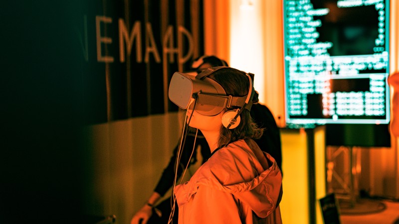 Image of a women wearing VR goggles [Article Image]