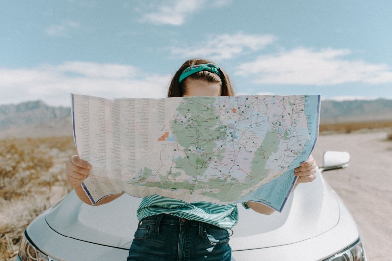 Photo of a woman looking at a map