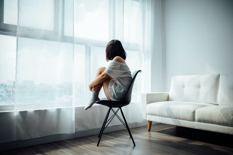 Photo of a woman sitting on a chair [Article Image]