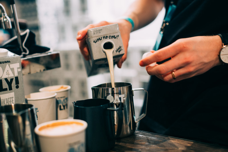 Image of Oatly being poured in a cup [Article Image]