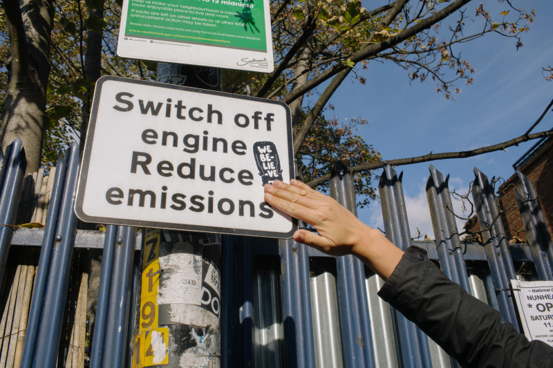 Image of a sign with an Oatly sticker [Article Image]