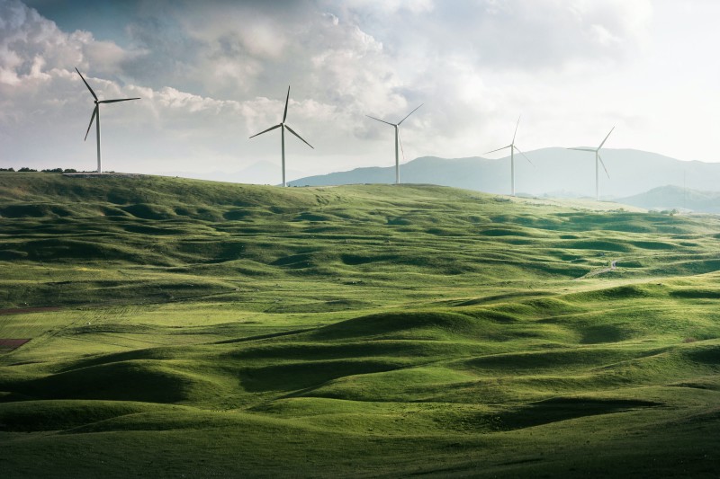 Photograph of hills with windmills