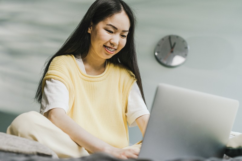 Woman sitting in front of her laptop 