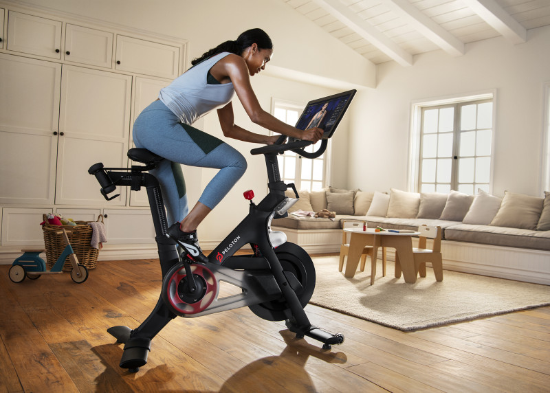 Woman on a Peloton bike