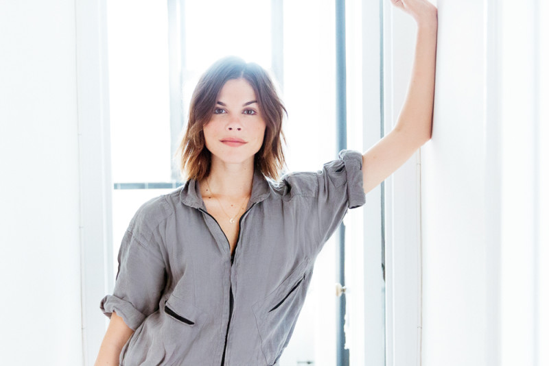 Photo of Emily Weiss in front of a window