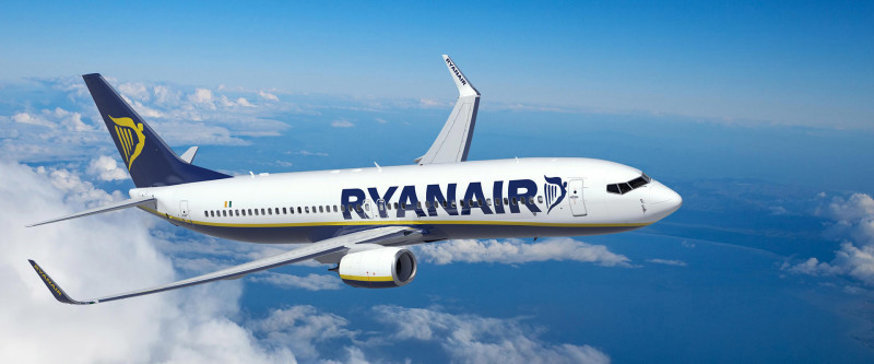 Ryanair plane flying through the sky