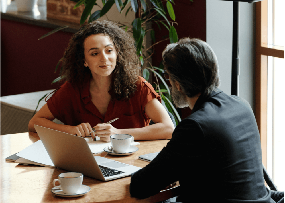 People working over a cup of coffee