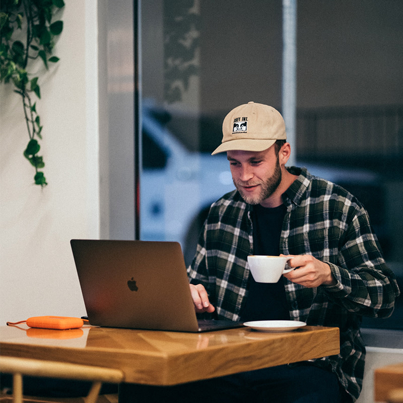 Man with coffee and hat