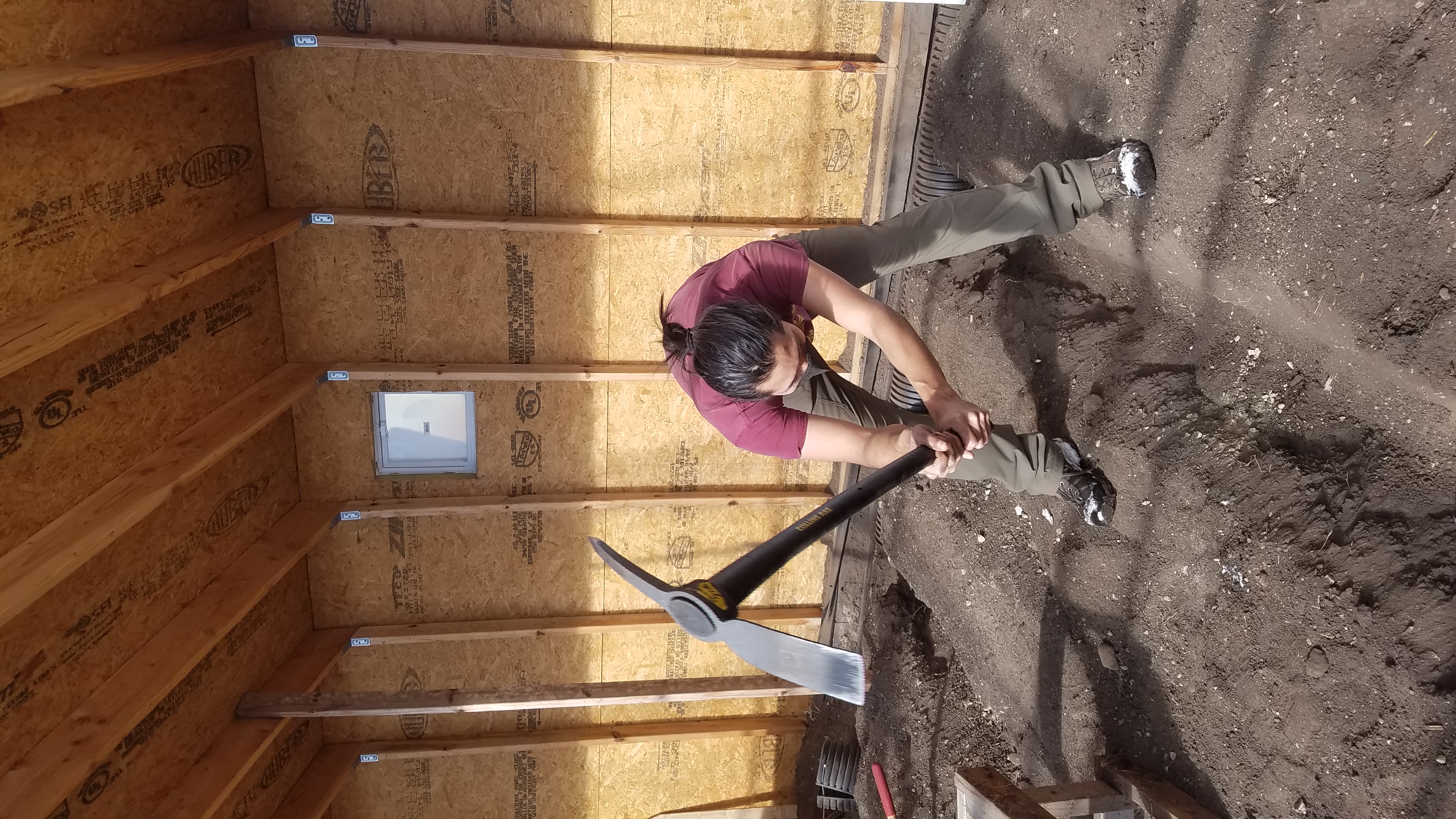 A person digging into the ground