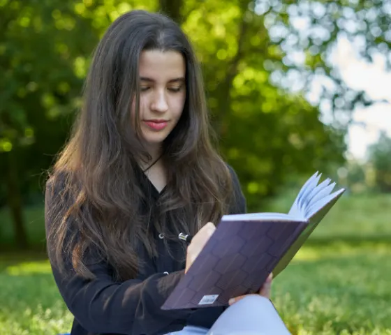 Girl writing in a book