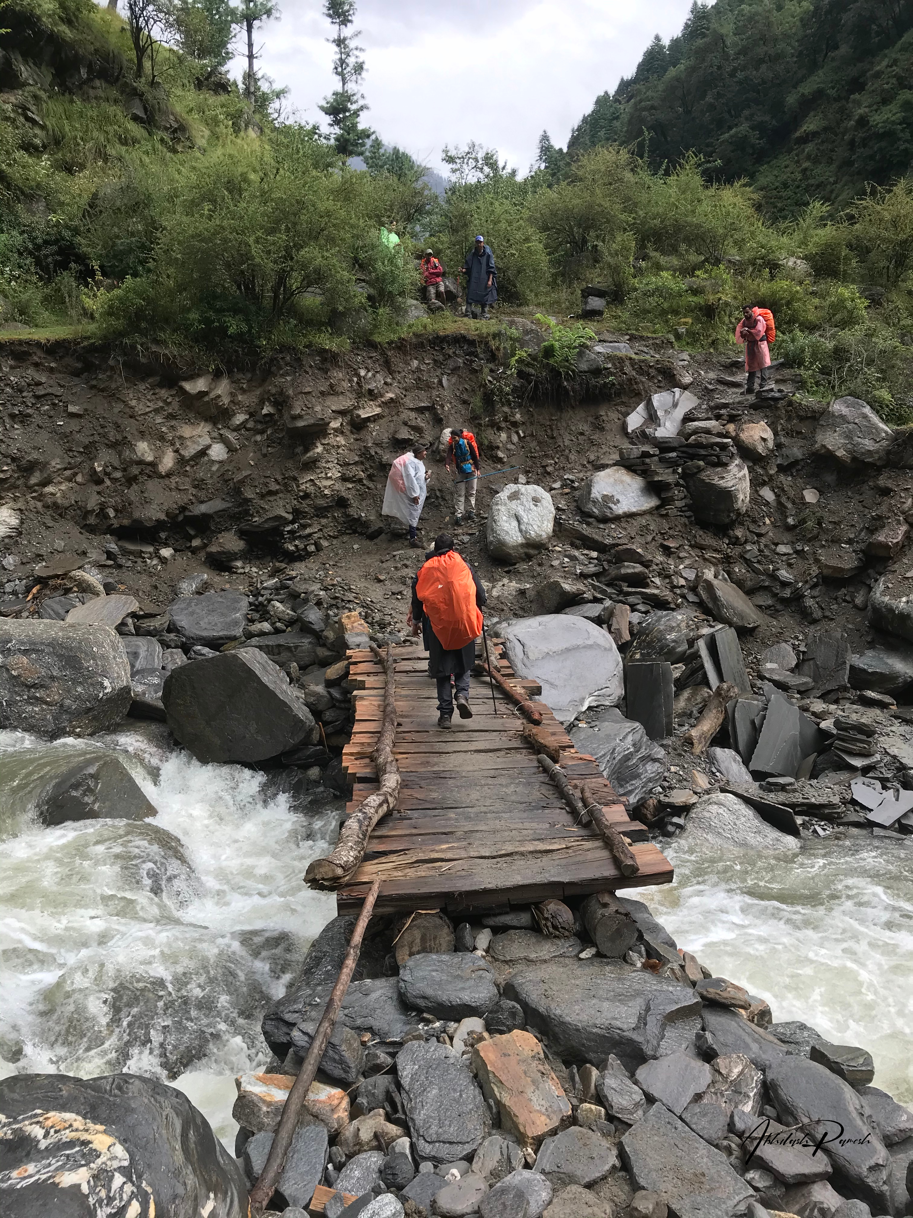 People walking across the bridge