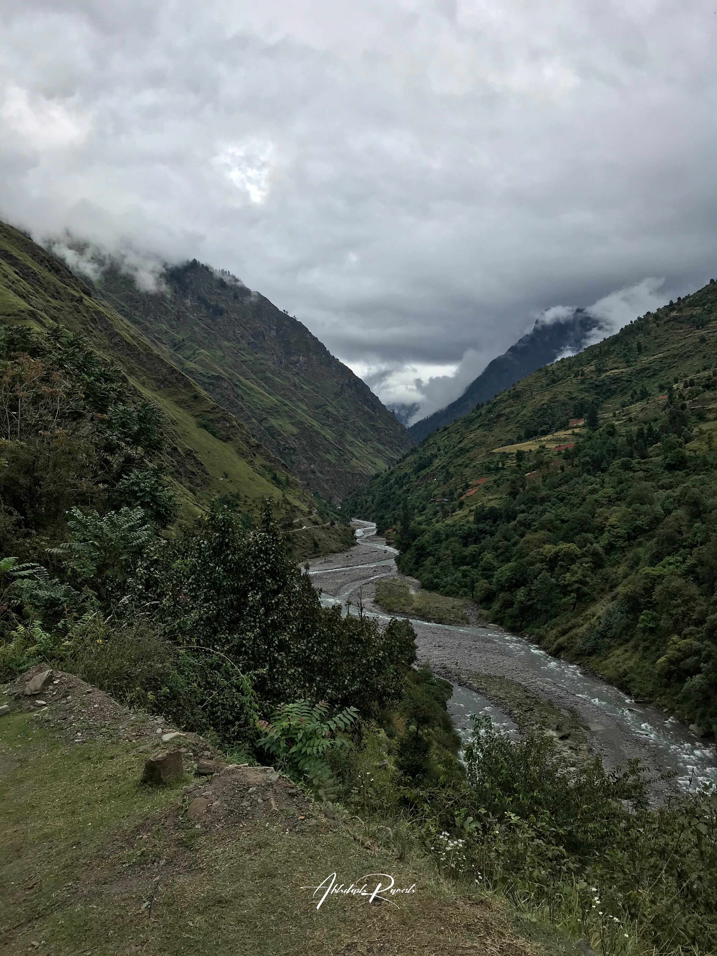 A valley overlooking from the top of a mountain