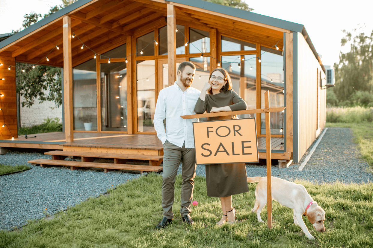 A couple selling their house for cash with their dog.