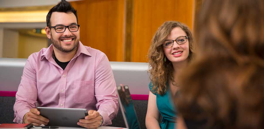 Three employees in a meeting