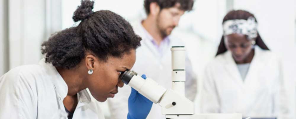 Three researchers in lab