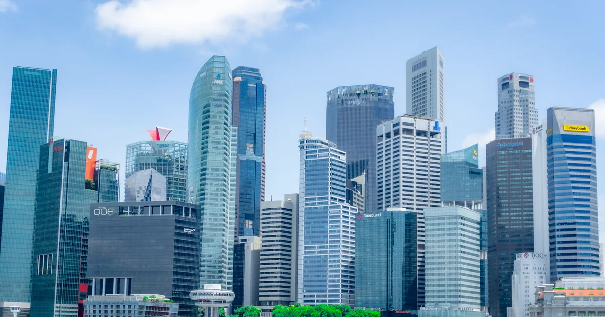 Singapore's Marina Bay business-district skyline of modern skyscrapers under daylight.