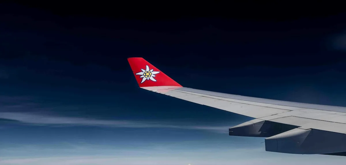 View of an airplane wing above the clouds during flight.  (source: https://images.unsplash.com/photo-1721068466638-b80ca5b35662)