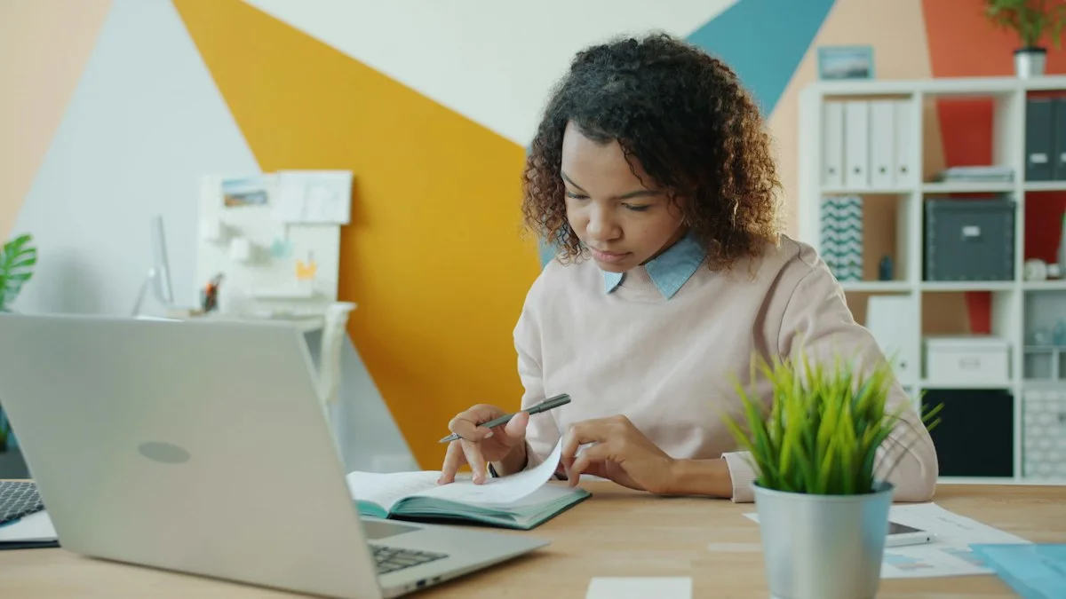 An agent reviewing a booking notebook beside a laptop in a bright office. (source: https://images.unsplash.com/photo-1758874384555-37d50c0ee81a)