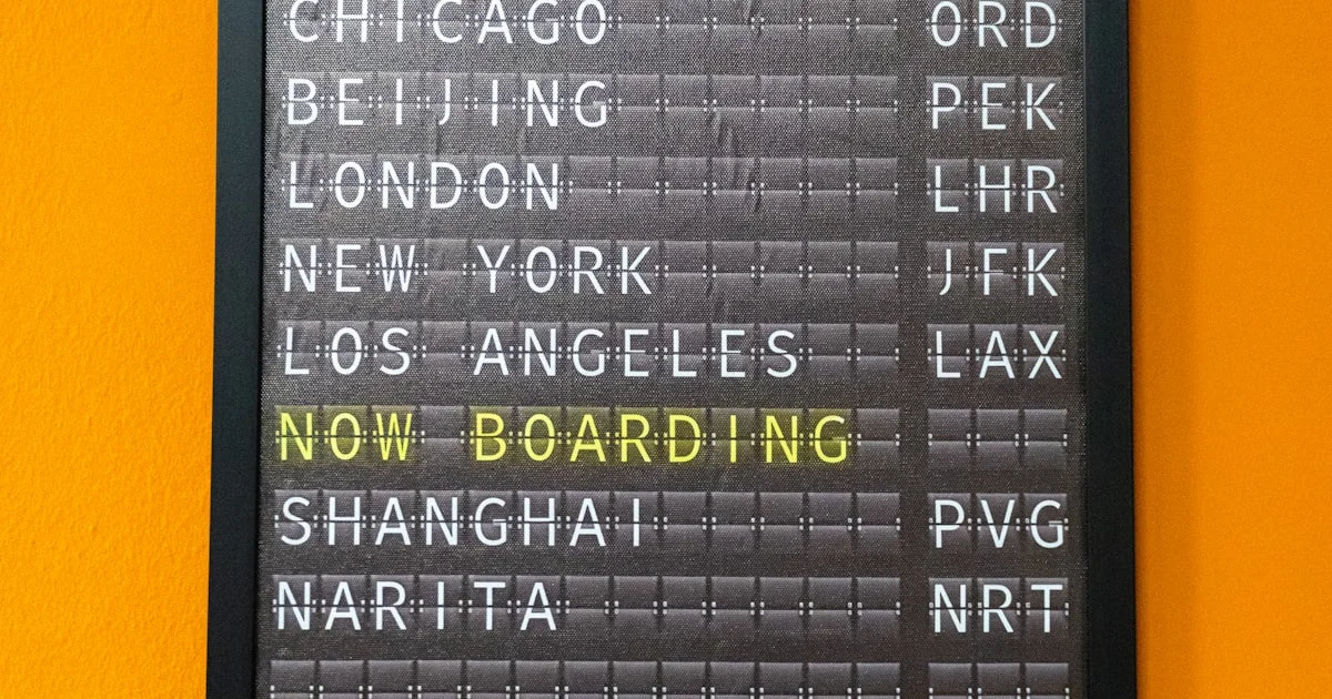 An airport departure board displaying flight information for departing passengers.