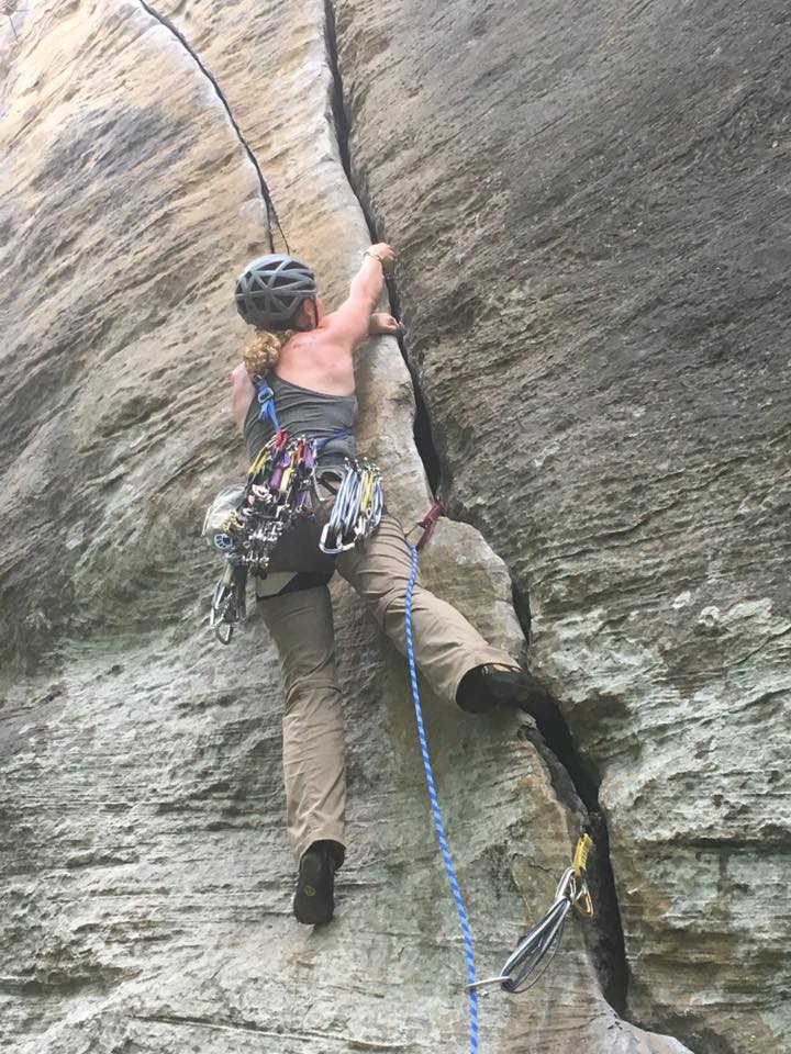 Woman Leading A Crack Climb