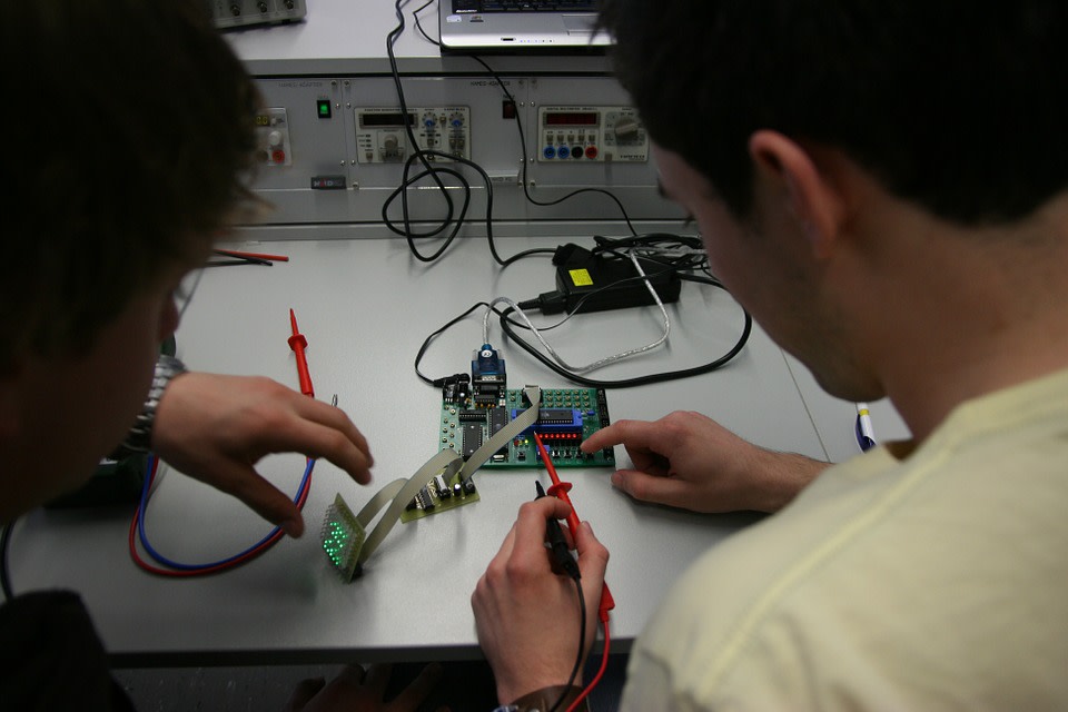 Engineers examine a tool 